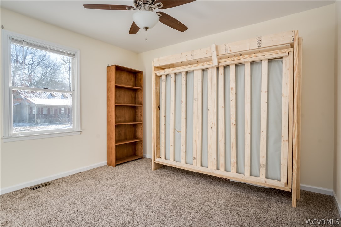 15948 Sandwave Road Chester, VA 23831 - Photo 15 of 22 a view of an empty room with a window