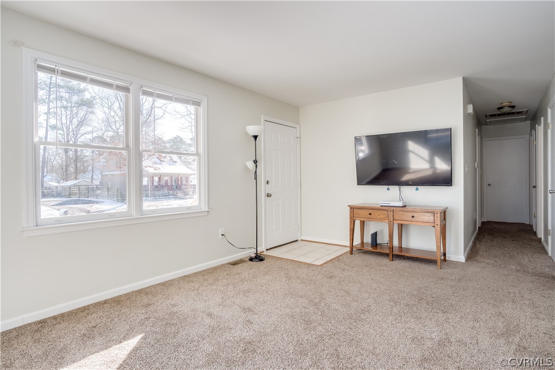 15948 Sandwave Road Chester, VA 23831 - Photo 6 of 22 a living room with furniture and a flat screen tv