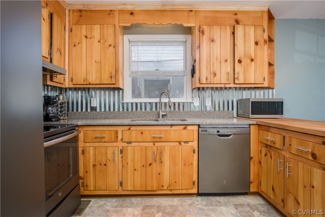 15948 Sandwave Road Chester, VA 23831 - Photo 8 of 22 a view of a kitchen with granite countertop cabinets and a refrigerator