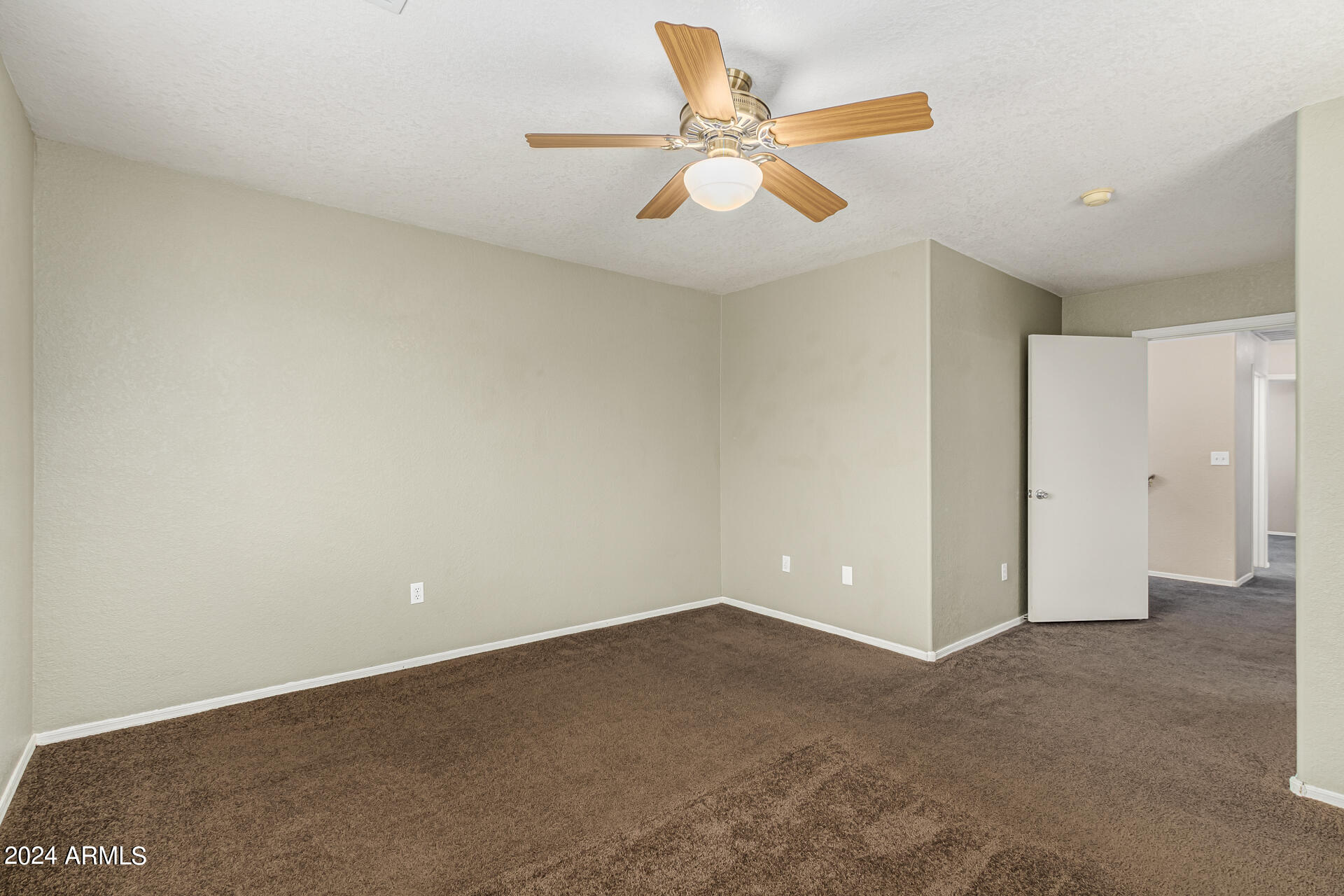 1371 South Boulder Street, Unit A Gilbert, AZ 85296 - Photo 21 of 43 an empty room with closet and fan