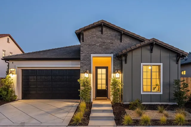 a front view of a house with glass windows
