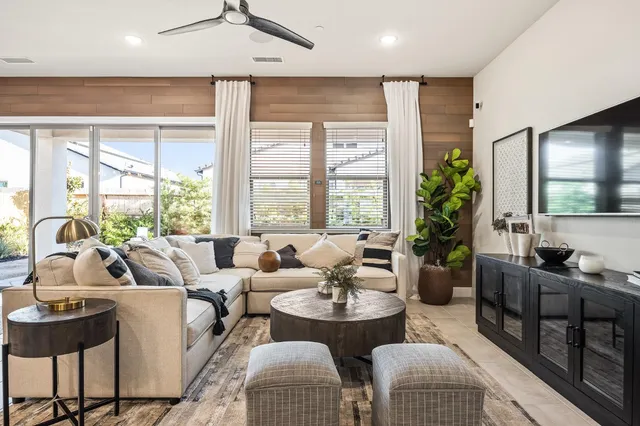 a bedroom with bed and a chandelier