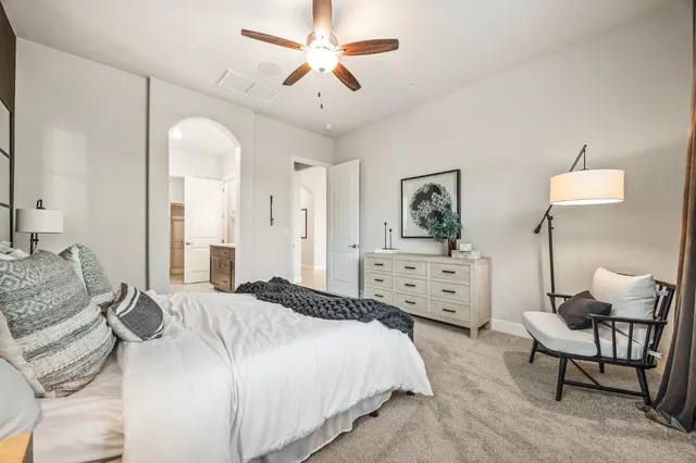 a spacious bathroom with a tub sink shower and mirror