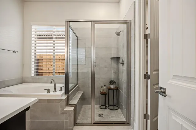 a white bath tub sitting next to a window