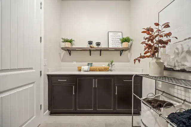 a kitchen with a refrigerator and cabinets