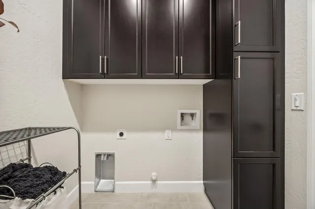 a bedroom with a bed next to a window