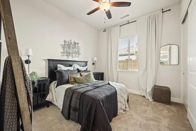 a bedroom with a bed and a couch