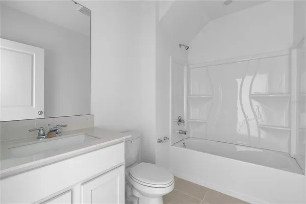 a bathroom with a sink a toilet and a bathtub