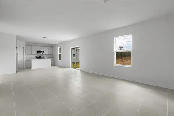 a view of a kitchen with a sink and a window