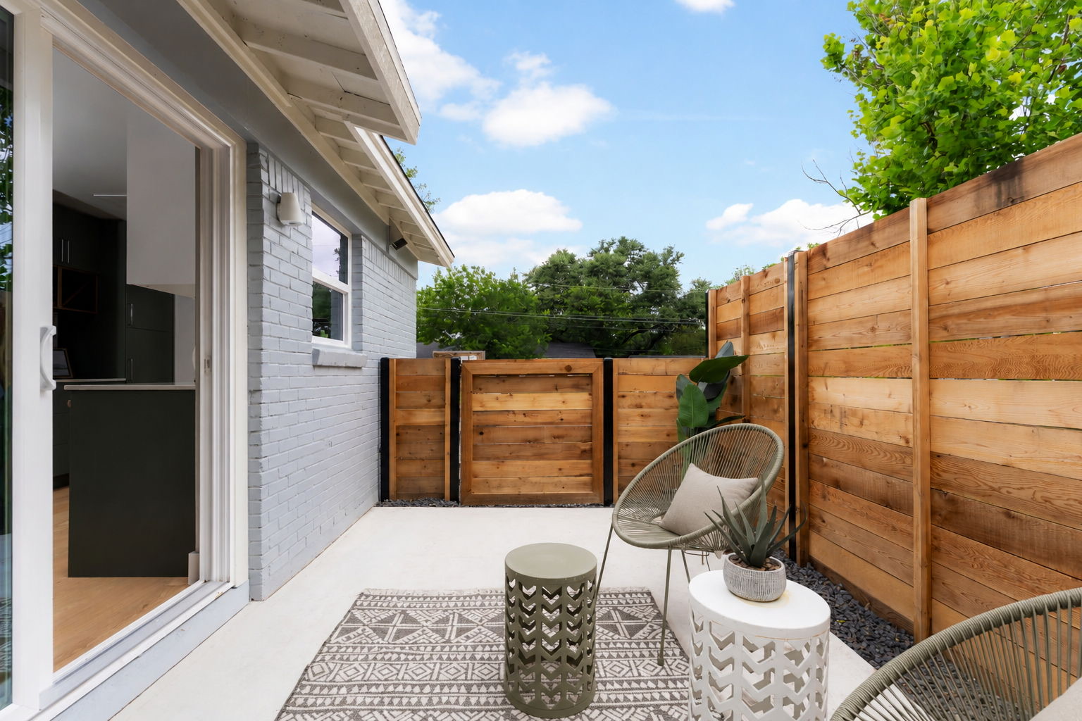4902 Blueberry Trail, Unit 1 Austin, TX 78723 - Photo 28 of 30 a view of a balcony with chair and wooden floor