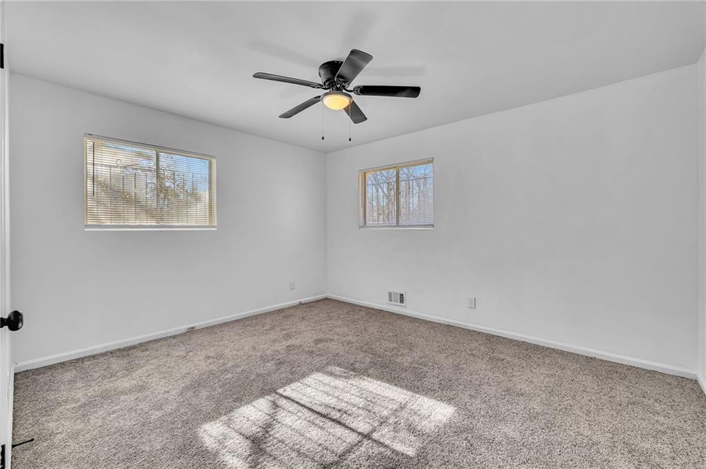 2356 County Line Road Southwest Atlanta, GA 30331 - Photo 18 of 22 a view of room with ceiling fan and window