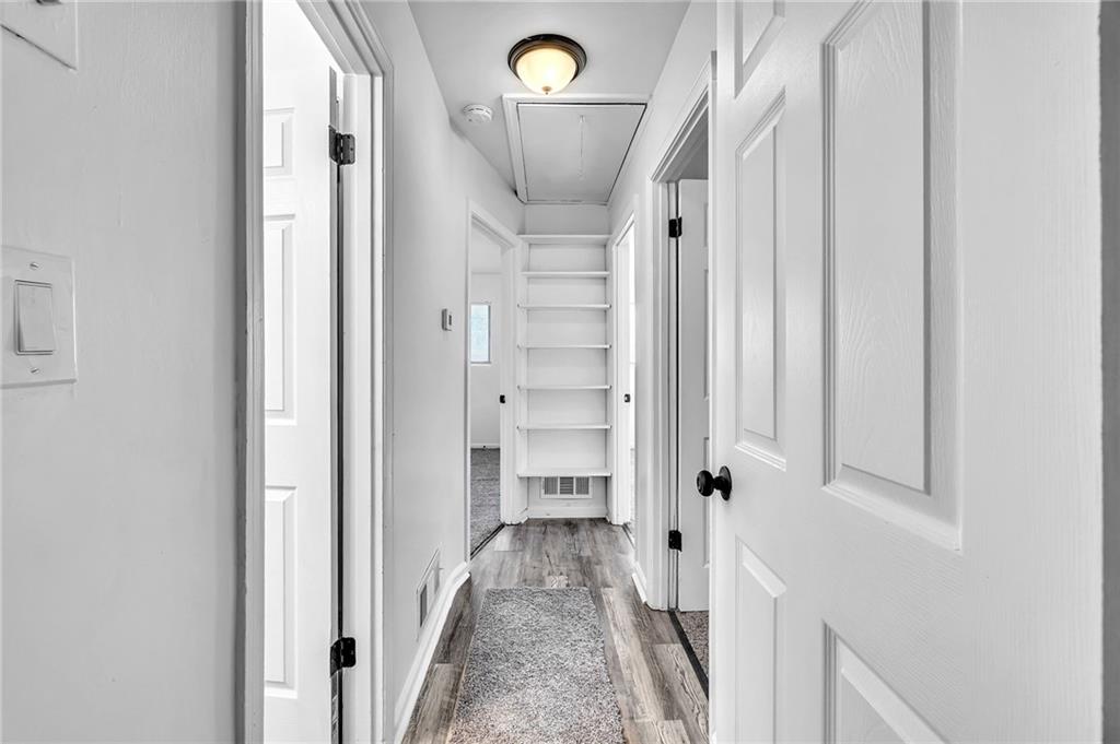2356 County Line Road Southwest Atlanta, GA 30331 - Photo 22 of 22 a view of a hallway with wooden floor and staircase