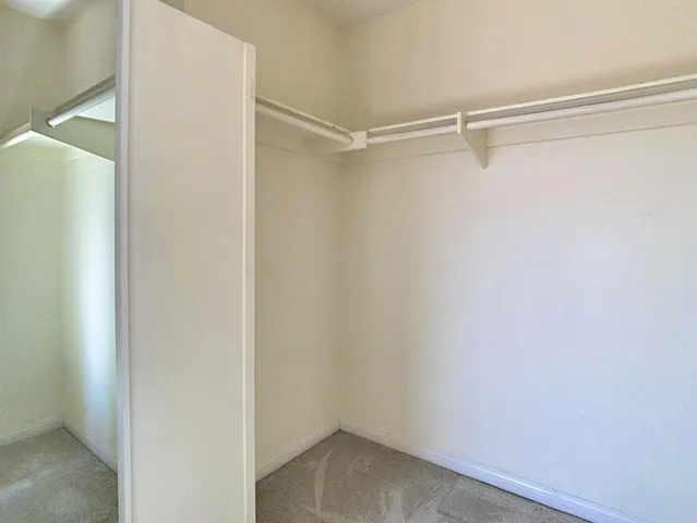 a view of an empty walk in closet