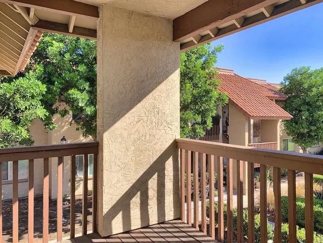 a view of a balcony with plants