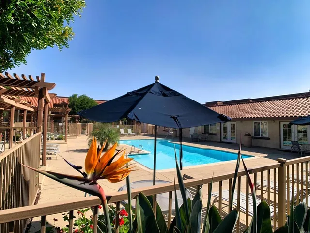 a view of an chairs and tables in the balcony