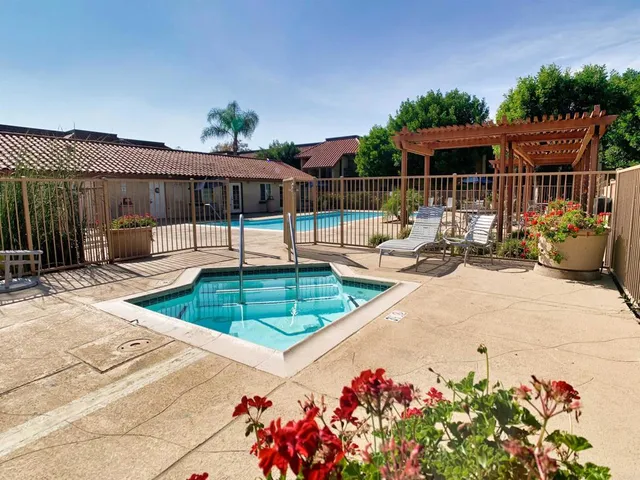 a view of a backyard with sitting area
