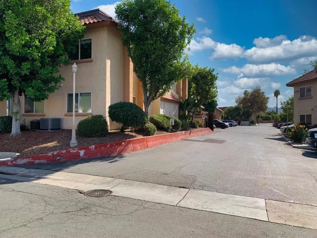 a view of street with parked cars