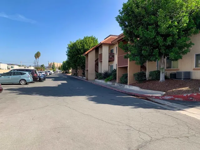 a couple of cars parked in front of a house