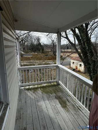 a view of balcony with wooden floor