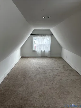 an empty room with windows and entrance