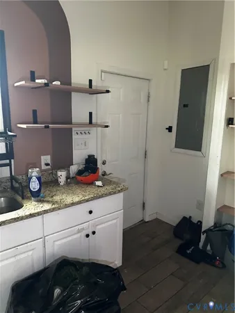 a kitchen with a sink and cabinets