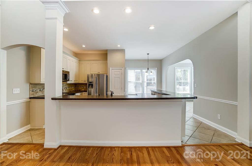 3233 Colonel Springs Way Fort Mill, SC 29708 - Photo 12 of 48 a large kitchen with stainless steel appliances a large counter top a stove and a refrigerator