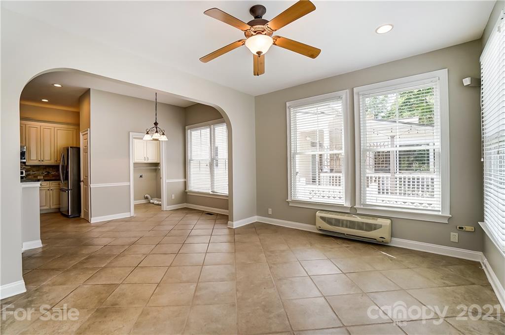 3233 Colonel Springs Way Fort Mill, SC 29708 - Photo 22 of 48 a view of a livingroom with a ceiling fan and window