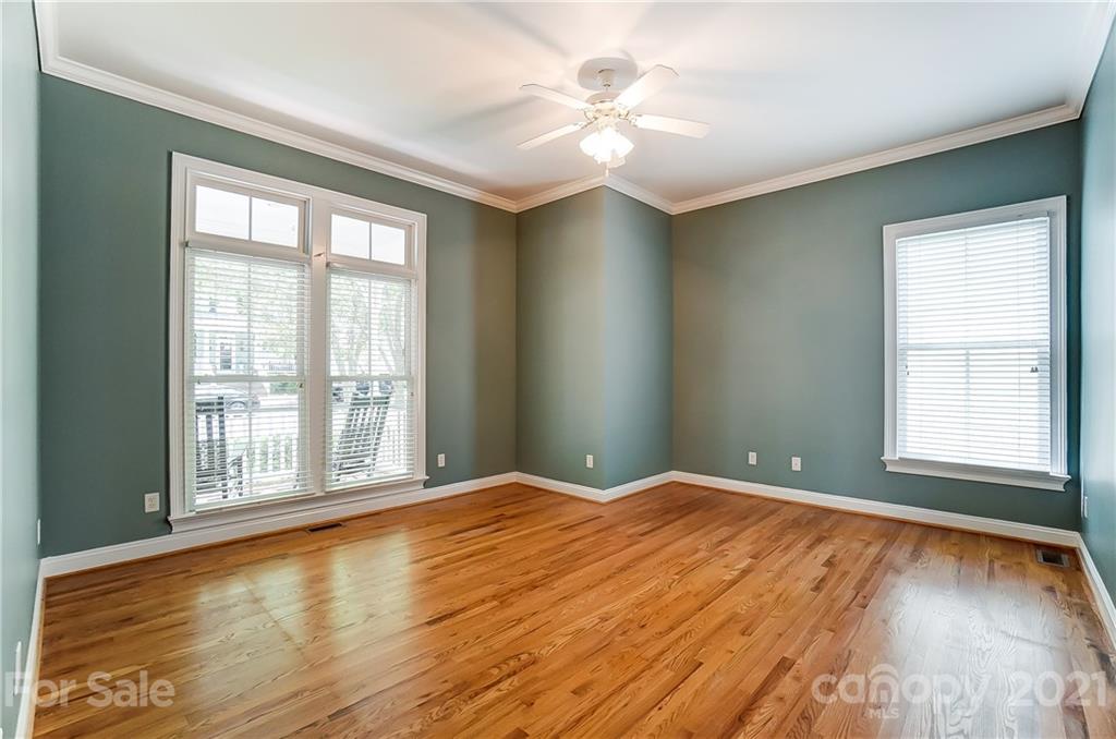 3233 Colonel Springs Way Fort Mill, SC 29708 - Photo 25 of 48 a view of an empty room with wooden floor and a window