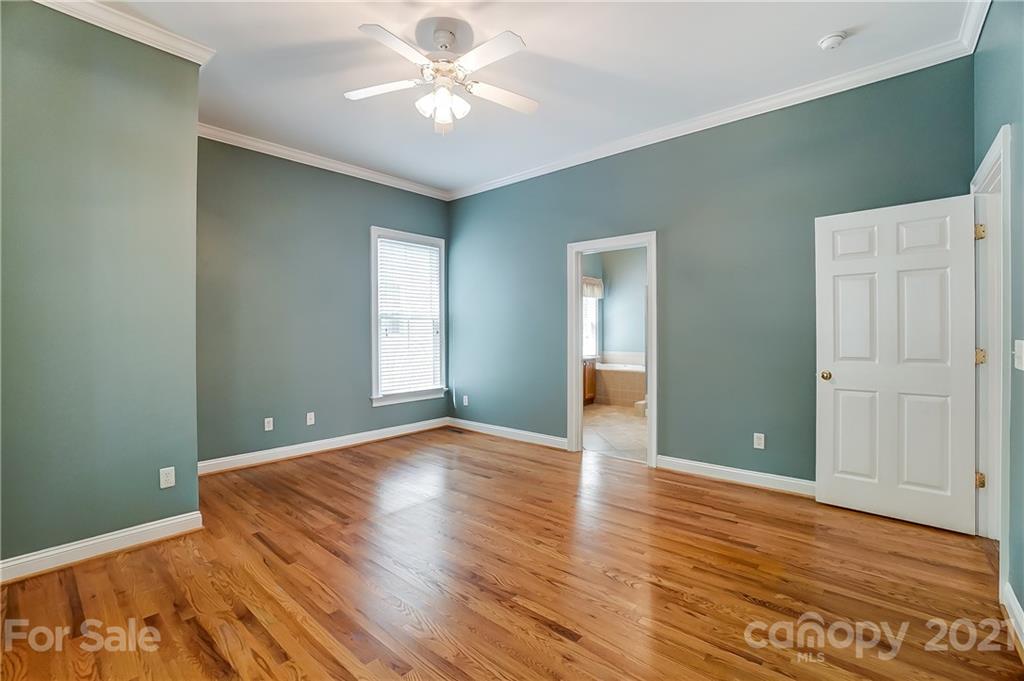 3233 Colonel Springs Way Fort Mill, SC 29708 - Photo 27 of 48 an empty room with wooden floor and windows