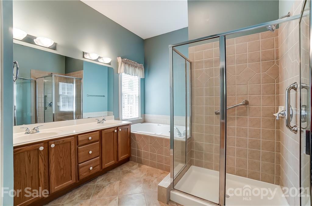 3233 Colonel Springs Way Fort Mill, SC 29708 - Photo 28 of 48 a bathroom with a double vanity sink and a mirror