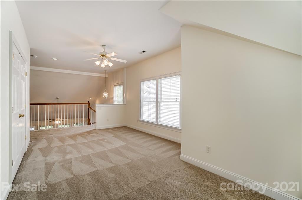 3233 Colonel Springs Way Fort Mill, SC 29708 - Photo 31 of 48 a view of a livingroom with a ceiling fan and window
