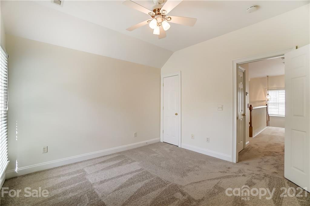 3233 Colonel Springs Way Fort Mill, SC 29708 - Photo 35 of 48 a view of a livingroom with a ceiling fan and window