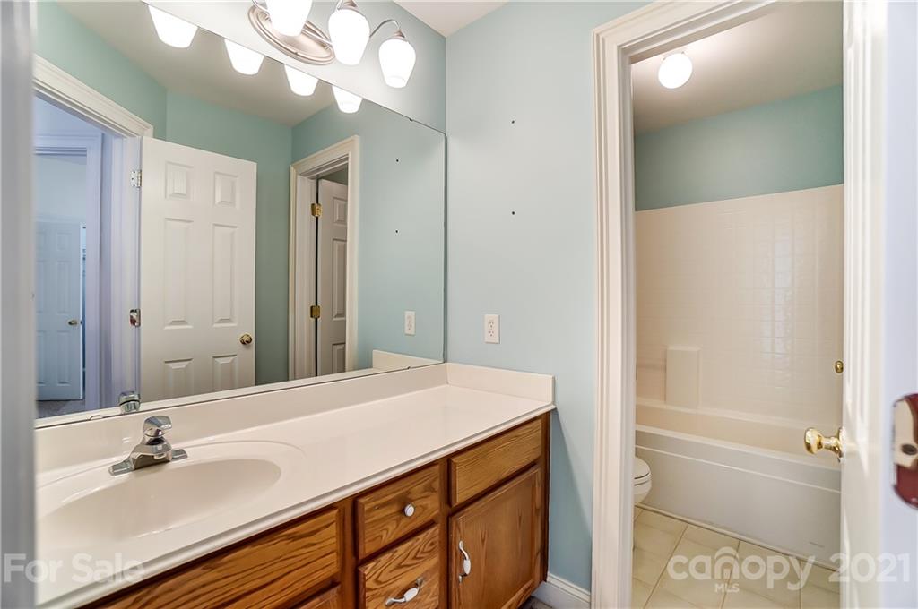 3233 Colonel Springs Way Fort Mill, SC 29708 - Photo 36 of 48 a bathroom with a sink a vanity and a mirror