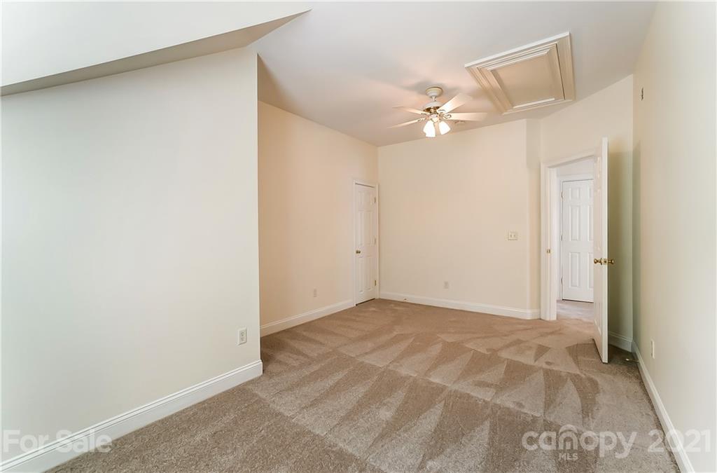 3233 Colonel Springs Way Fort Mill, SC 29708 - Photo 39 of 48 an empty room with a ceiling fan and a window