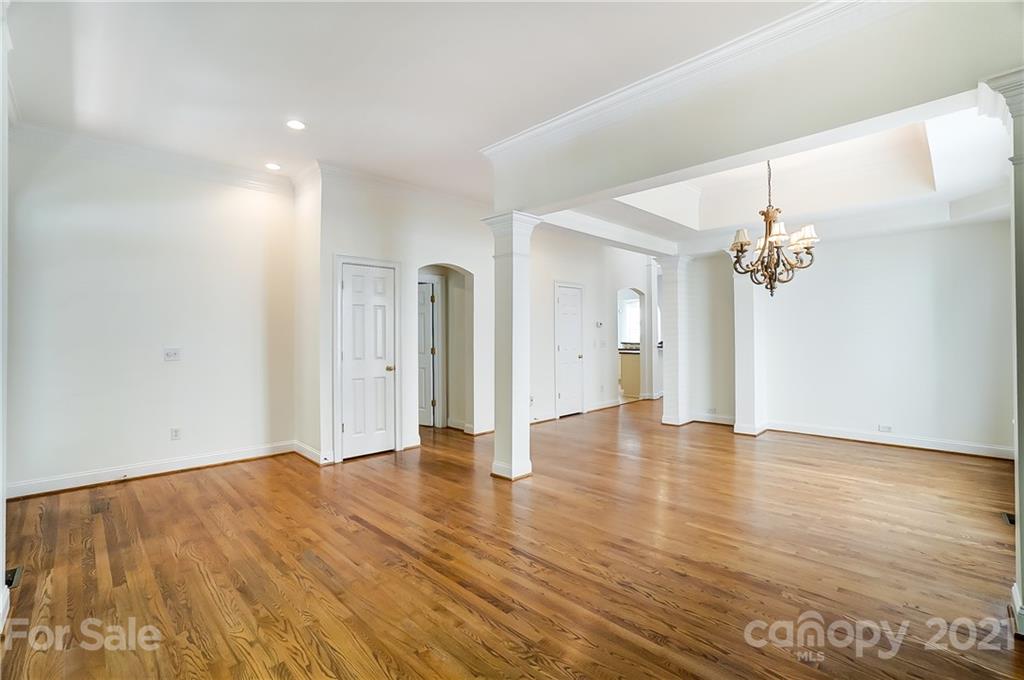 3233 Colonel Springs Way Fort Mill, SC 29708 - Photo 5 of 48 wooden floor in an empty room with a window
