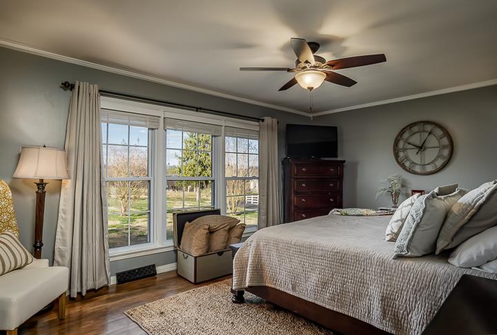 757 Robinson Ridge Road Baxter, TN 38544 - Photo 11 of 26 a bedroom with a bed and a large window