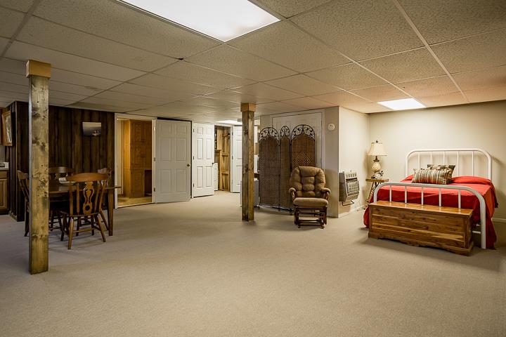 757 Robinson Ridge Road Baxter, TN 38544 - Photo 16 of 26 a bedroom with furniture and a large window