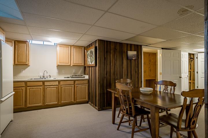 757 Robinson Ridge Road Baxter, TN 38544 - Photo 17 of 26 a kitchen with a table chairs sink and cabinets