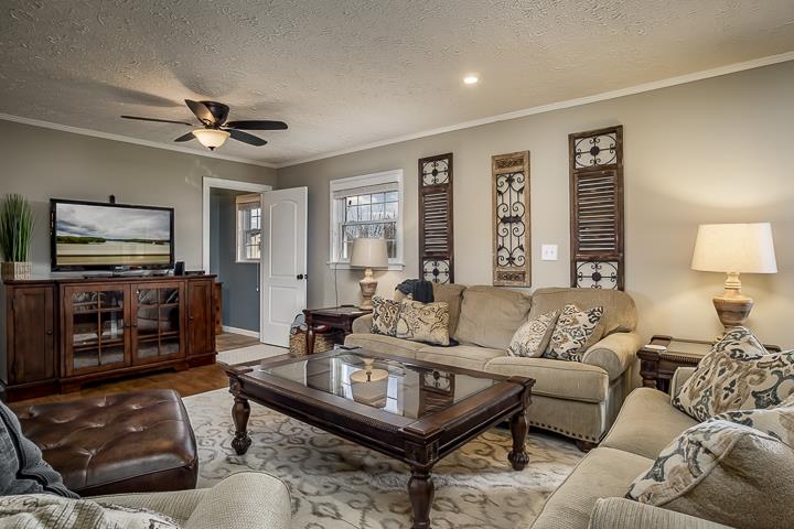 757 Robinson Ridge Road Baxter, TN 38544 - Photo 2 of 26 a living room with furniture a large window and a flat screen tv