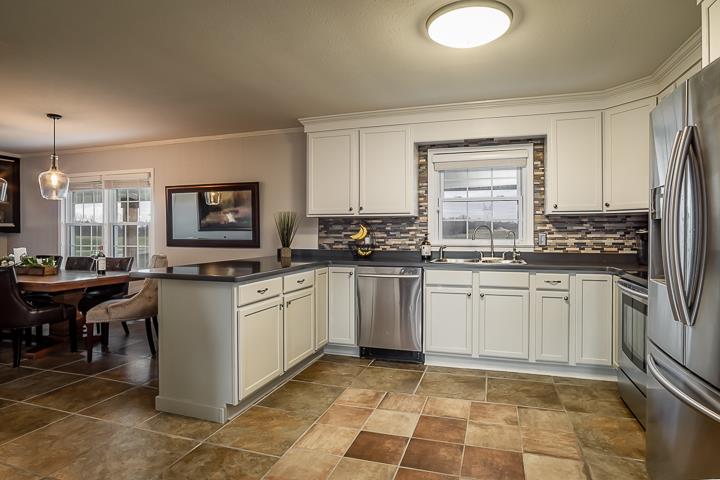 757 Robinson Ridge Road Baxter, TN 38544 - Photo 8 of 26 a kitchen with granite countertop appliances cabinets and furniture