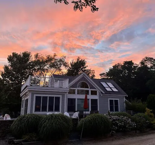 front view of a house with a garden