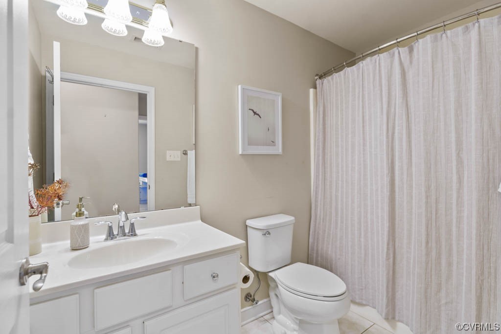 11609 Hillside Road Chester, VA 23831 - Photo 23 of 32 a bathroom with a sink a toilet and a mirror