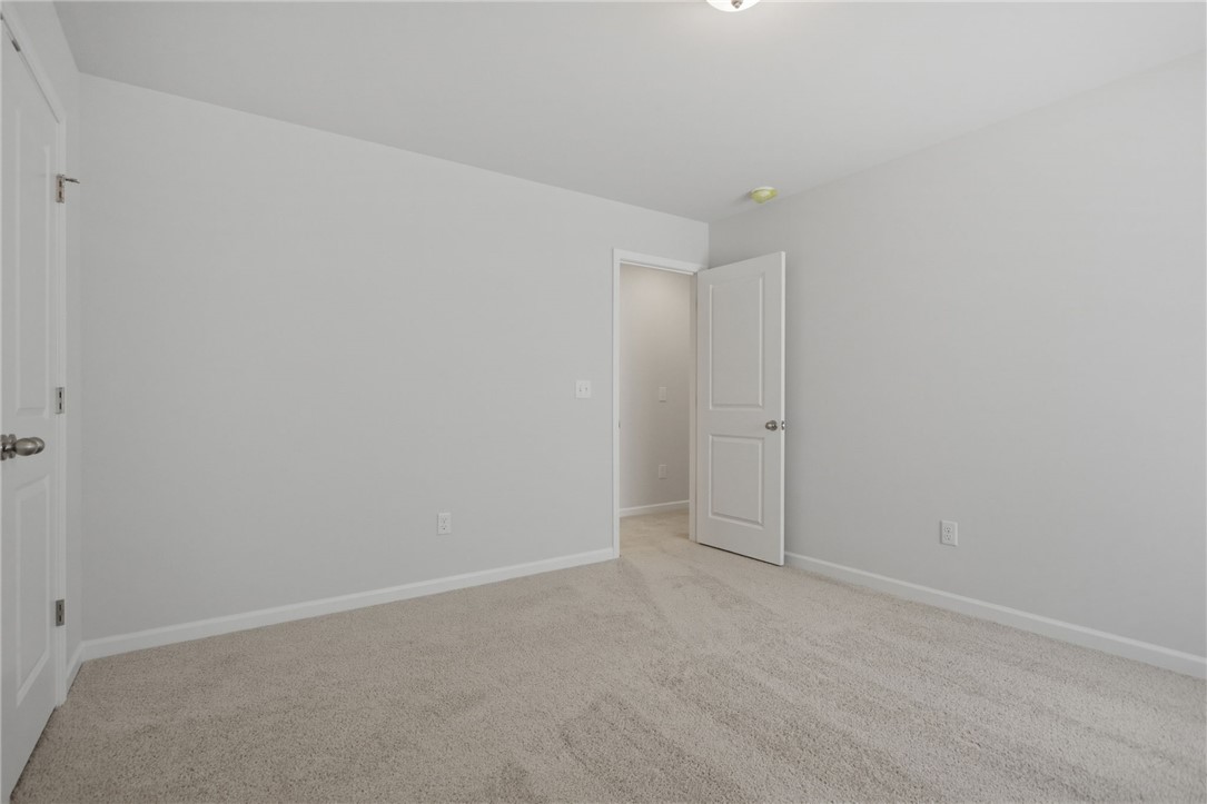 557 Hydrangea Street, Unit LOT 46 Seneca, SC 29678 - Photo 32 of 37 Well-kept flooring and a clean color palette await your personal touch in this versatile bedroom.
