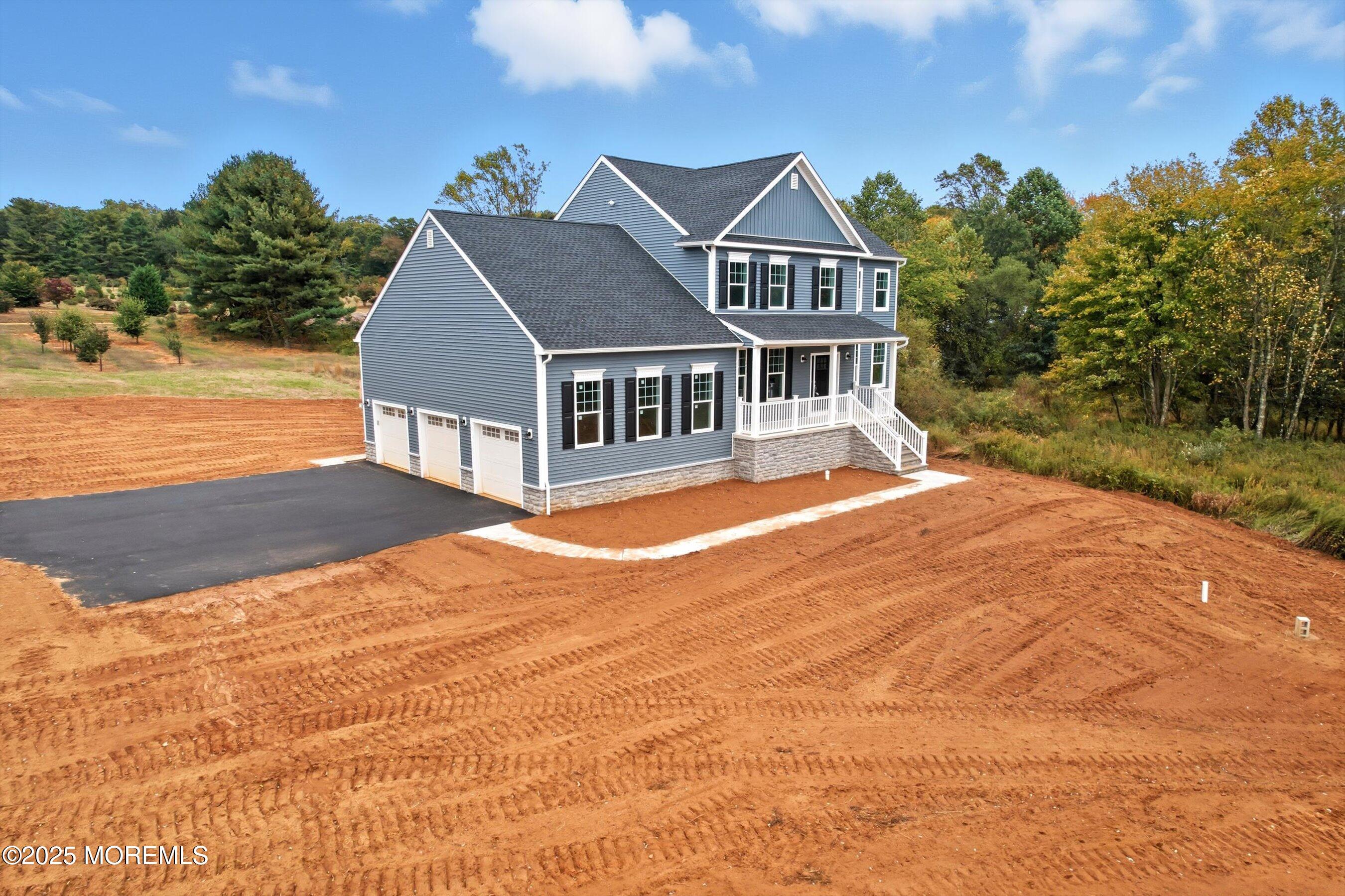 169 Davis Station Road Cream Ridge, NJ 08514 - Photo 2 of 57 a front view of a house with a yard