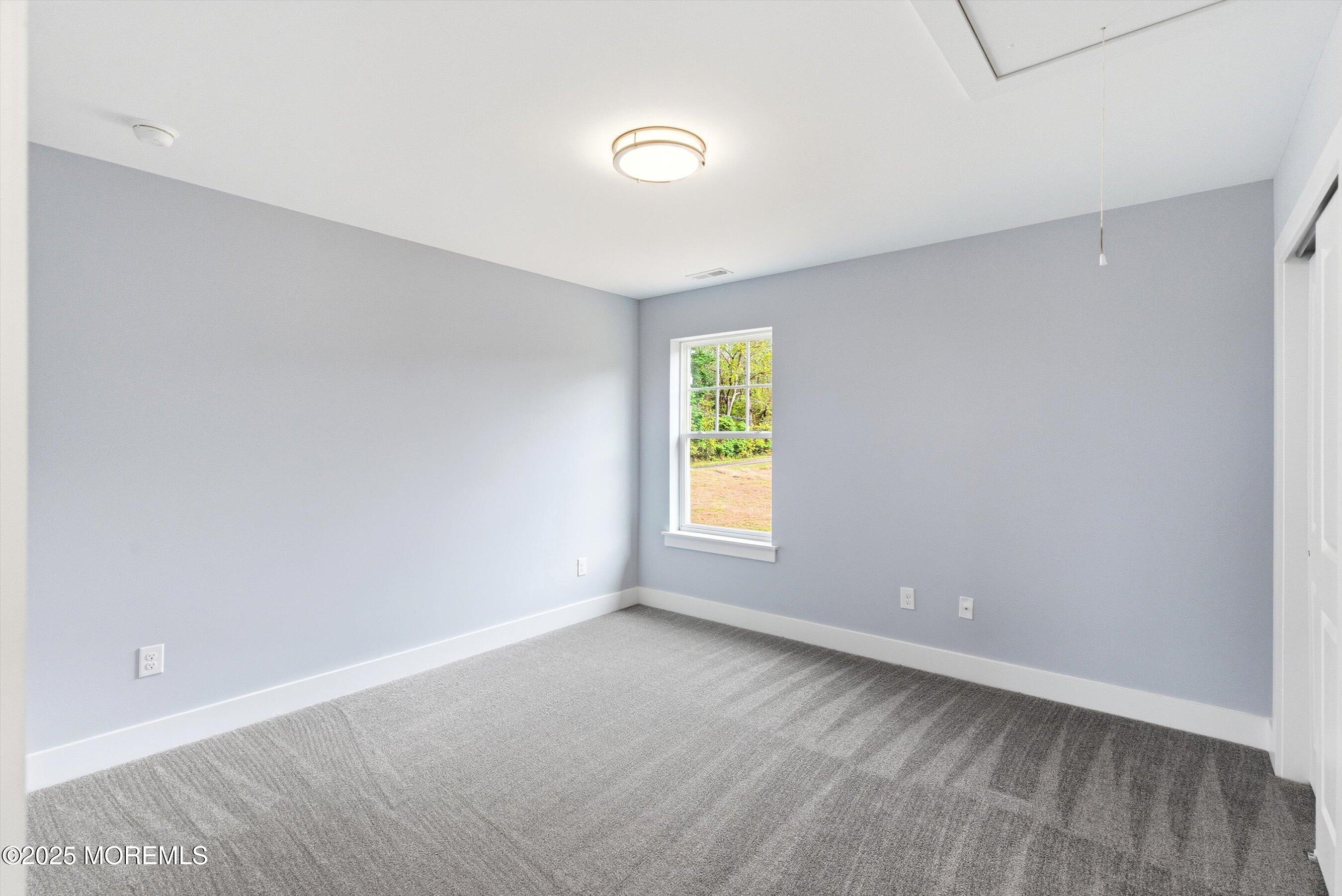 169 Davis Station Road Cream Ridge, NJ 08514 - Photo 35 of 57 a view of an empty room with a window