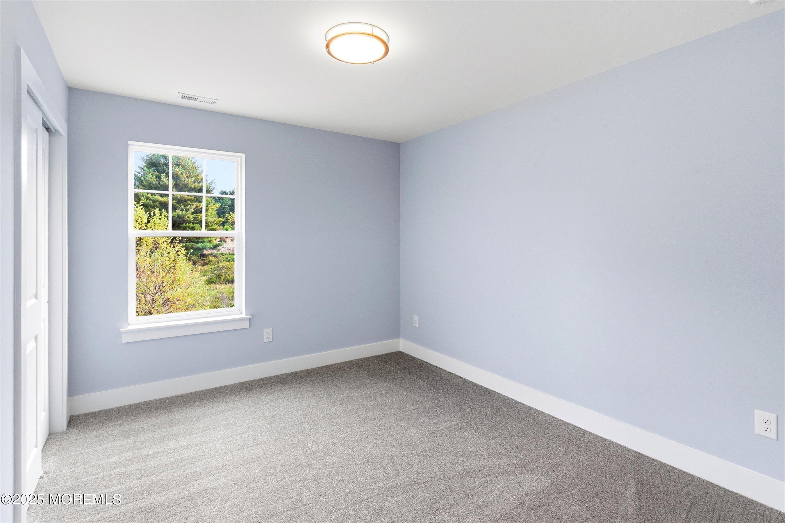 169 Davis Station Road Cream Ridge, NJ 08514 - Photo 38 of 57 an empty room with a window