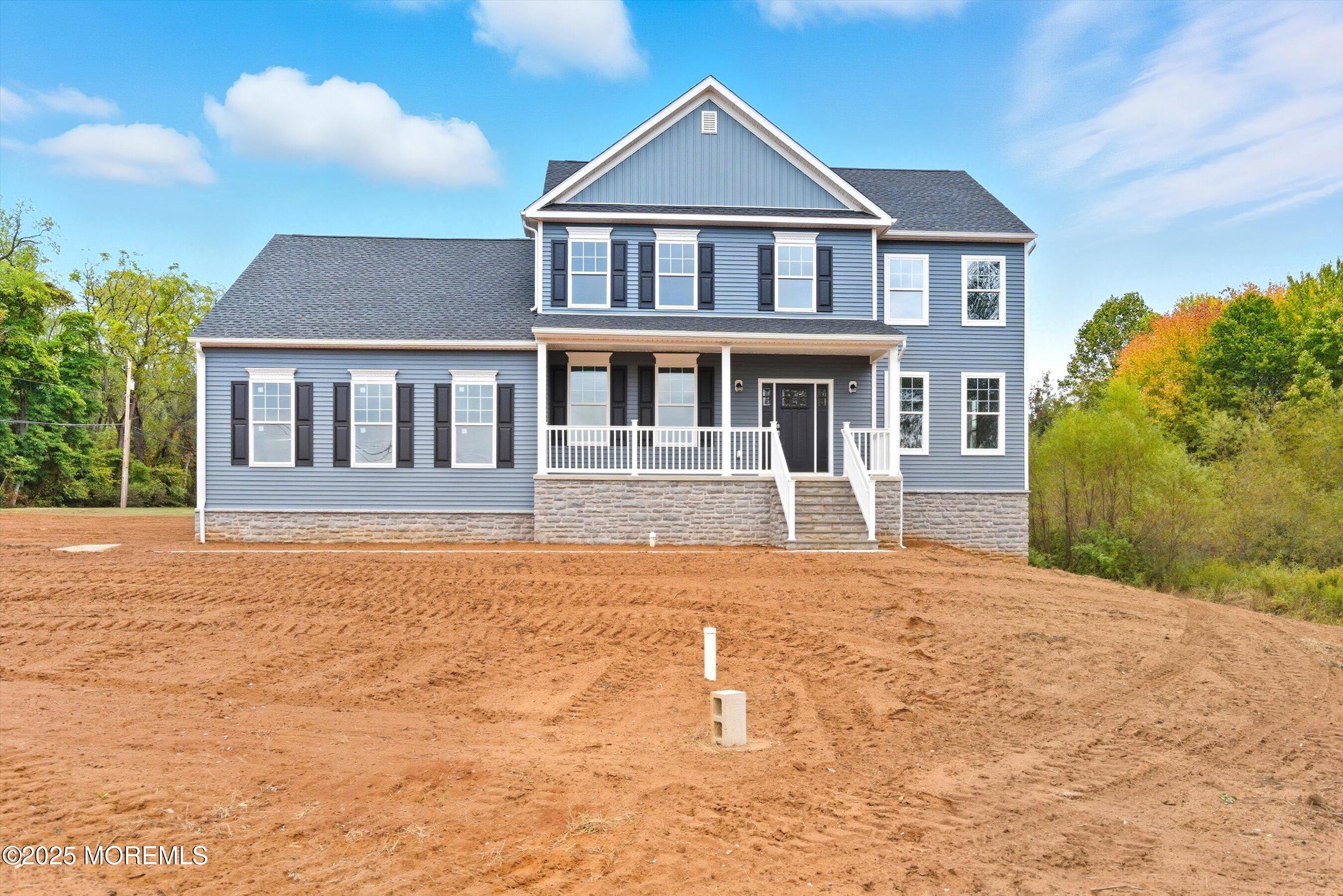 169 Davis Station Road Cream Ridge, NJ 08514 - Photo 53 of 57 a front view of a house with a yard and trees