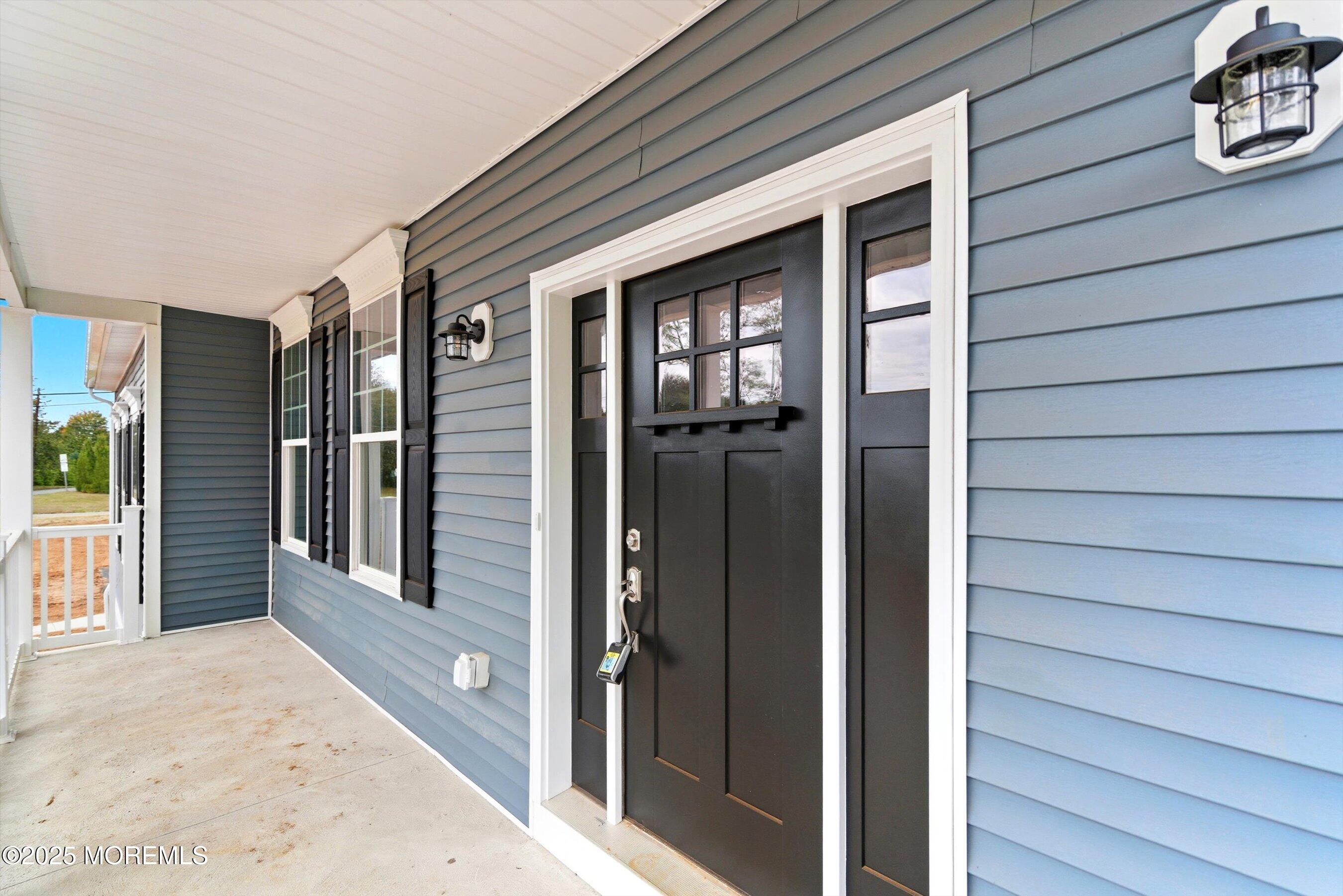 169 Davis Station Road Cream Ridge, NJ 08514 - Photo 54 of 57 a view of a house with a door and wooden walls