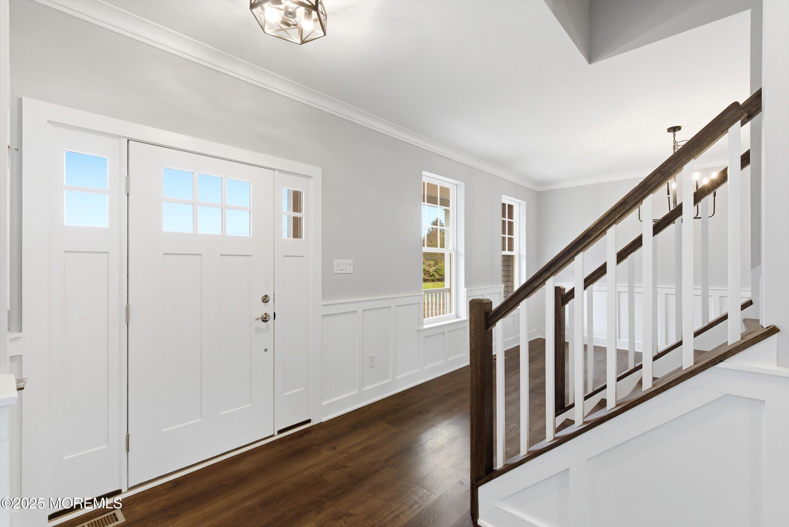169 Davis Station Road Cream Ridge, NJ 08514 - Photo 7 of 57 a view of an entryway with wooden floor