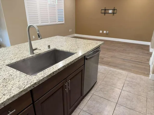 a view of a dining room with furniture and window